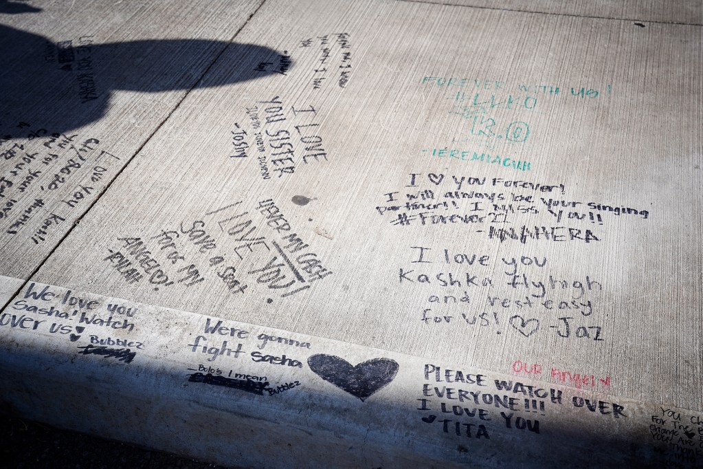 Messages near the memorial for Kashka Otto is photographed Friday, Oct. 18, 2024, at the Nanakuli Wendy’s in Waianae. The fast-food restaurant re-opens today after Otto, 22, was killed on Sunday, Oct. 6, during an altercation with a patron who allegedly stabbed the Wendy’s employee with a knife and injured another. Cotti Foods, owners of this franchise, is donating all proceeds to Otto’s family from today’s sales. (Kevin Fujii/Civil Beat/2024)