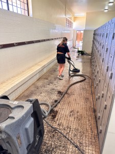 Red Lightning volunteer Ashley Crowley cleans the locker room on this July 17 photo. (courtesy: Red Lightning)