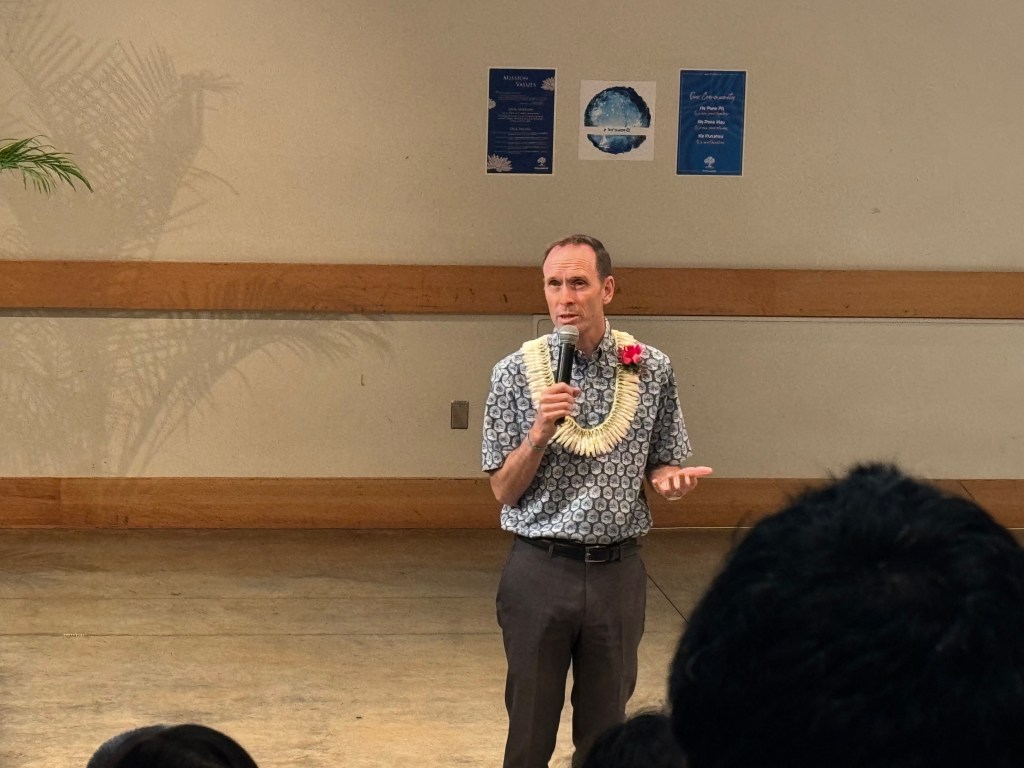 Punahou School President Michael Latham addresses parents during a family event on appropriate cell phone use and technology.