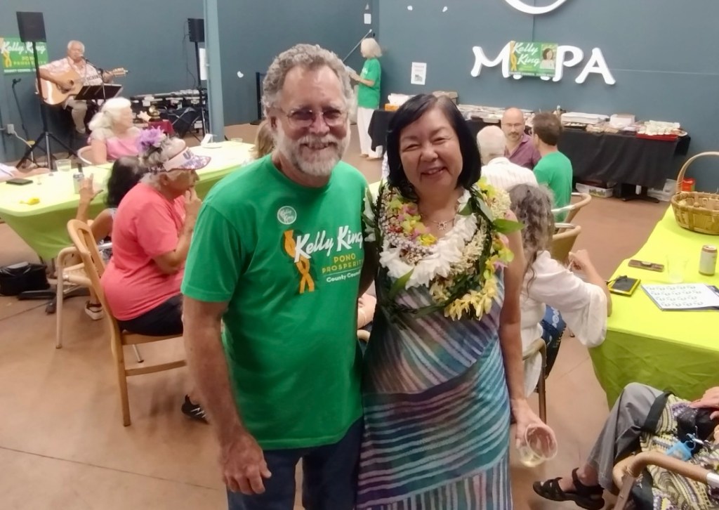 Former Maui County Council member Kelly King poses with her husband Bob King during an election party. (Léo Azambuja/Civil Beat/2024)