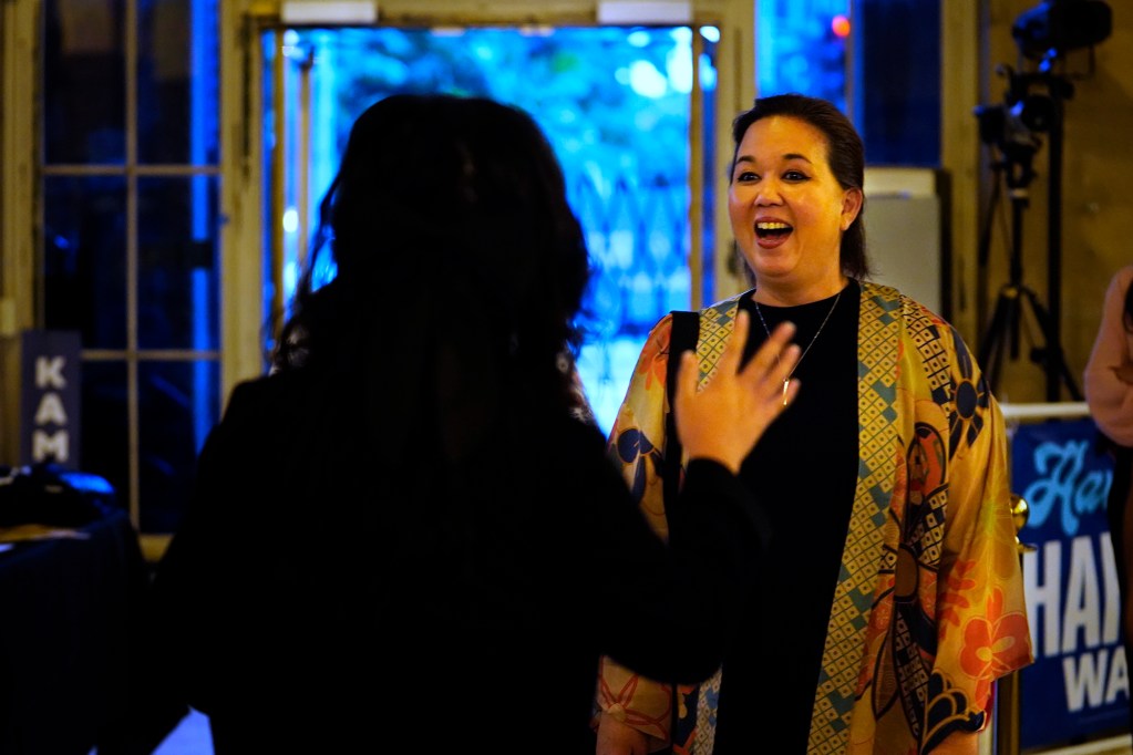 U.S. Rep. Jill Tokuda greets Isabelle Enriques, 16, the president and chairperson of the Hawaii Chapter of High School Democrats of America as Democrats gather on election night Tuesday, Nov. 5, 2024, in Honolulu. (Kevin Fujii/Civil Beat/2024)