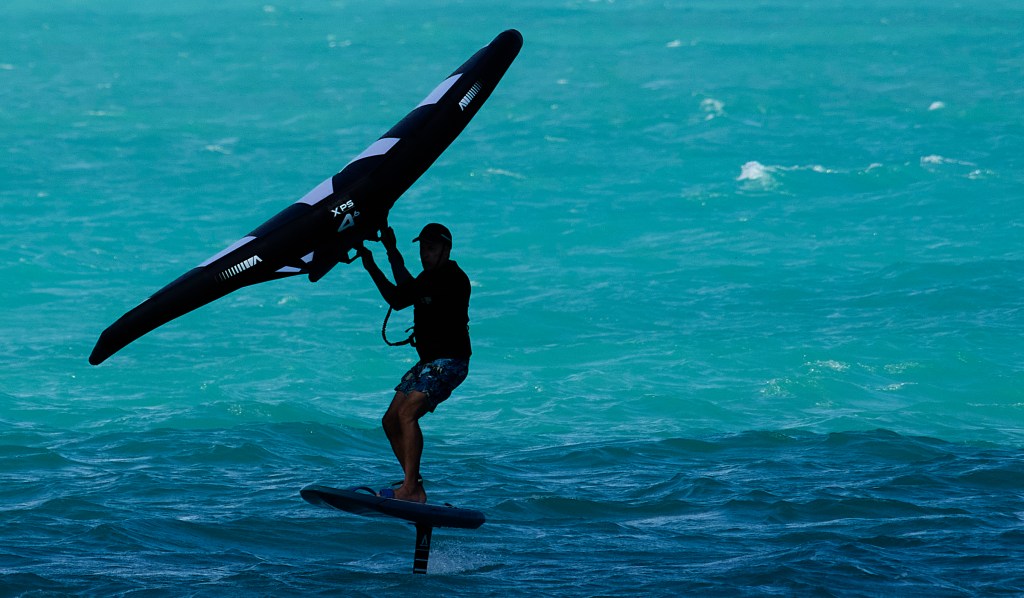Increasing Trade winds around the islands brought out local kite surfers, sail boarders and foil sail boarders onto Kailua Bay. All seemed to be enjoying their craft. Photographed 11.15.24 at Kailua Bay Beach Park. (David Croxford/Civil Beat/2024)