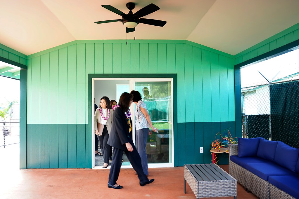 Lt. Gov. Sylvia Luke, left, steps out onto the lanai of the new Waiawa Correctional Facility ‘Ohana Visit and Resource Center Monday, Nov. 18, 2024, in Pearl City. The center offers inmates a place to meet with family including keiki and grandchildren. (Kevin Fujii/Civil Beat/2024)