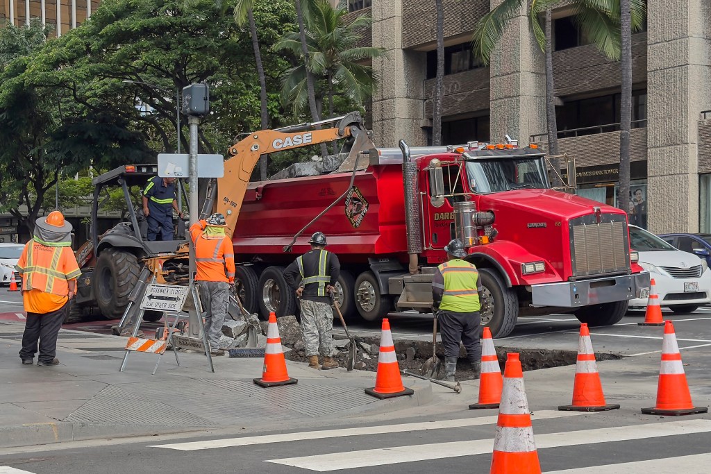 Construction crews were breaking up the right lane at the intersection of King and Alakea in downtown Honolulu, November 19th, 2024 (David Croxford/Civil Beat/2024)