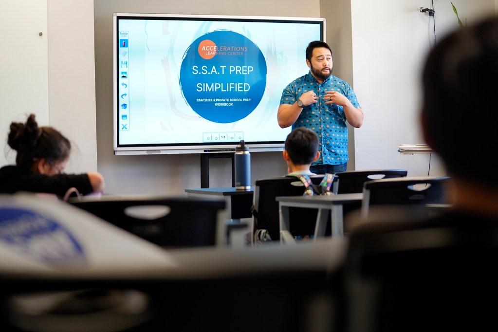 Brandt “Mr. B” Izumo leads a tutoring class Tuesday, Nov. 19, 2024, in Honolulu. (Kevin Fujii/Civil Beat/2024)