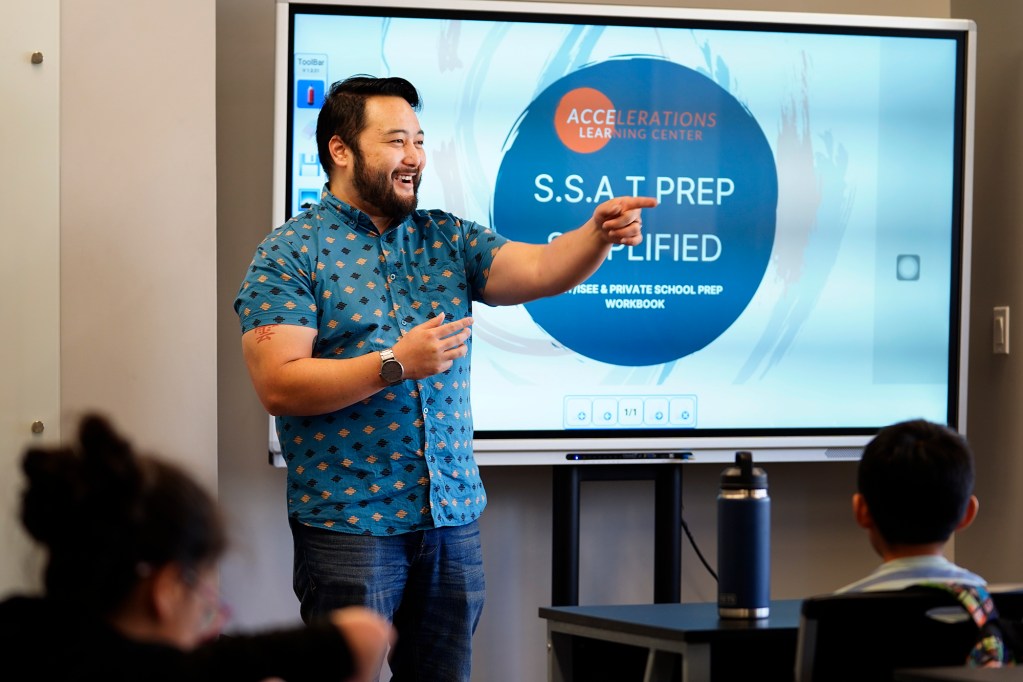 Brandt “Mr. B” Izumo leads a tutoring class Tuesday, Nov. 19, 2024, in Honolulu. (Kevin Fujii/Civil Beat/2024)