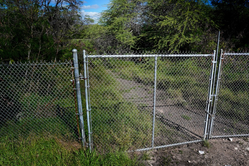 The locked gate to Ordy Pond in Barbers Point is photographed Thursday, Nov. 21, 2024, in Kapolei. (Kevin Fujii/Civil Beat/2024)