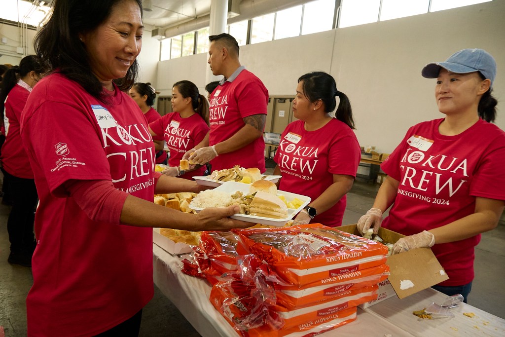 The Salvation Army Annual Thanksgiving Dinner for the community was held at the Blaisdell Exhibition Hall on November 28th.  Over 800 volunteers came together from all walks of life to assist in preparing, seating and feeding the more than 1500 attendees who enjoyed the Thanksgiving dinner.  Volunteers worked a prep line in the rear of the Blaisdell Exhibition Hall in order to deliver Thanksgiving Plates to those in attendance. (David Croxford/Civil Beat/2024)