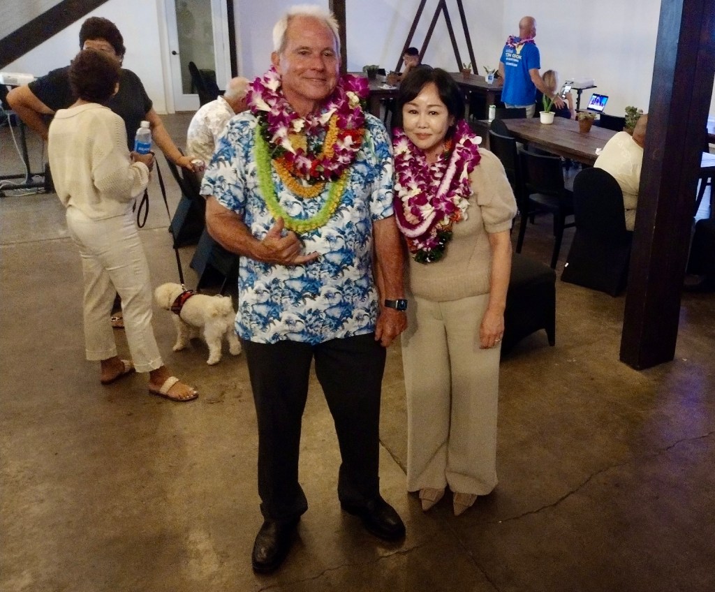 Maui County council member Tom Cook poses with his wife Heekyung Cook during his Election Day party in Kahului. (Léo Azambuja/Civil Beat/2024)