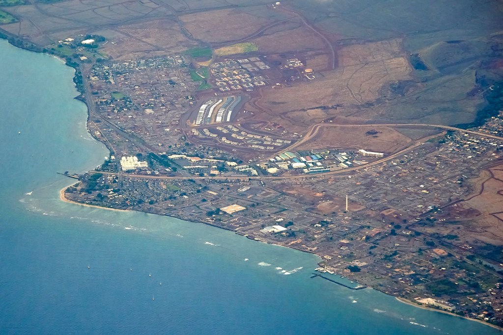 An aerial image from a flight out of Kahului, Maui, January 29th, reveals progress in Lahaina after a year and five months of clearing debris from the town. (David Croxford/Civil Beat/2025)