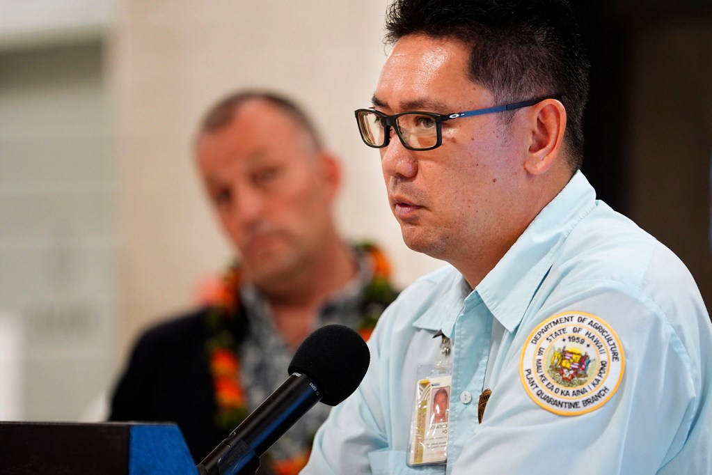 Department of Agriculture plant quarantine inspector Jonathan Ho speaks during the news briefing for digitizing the Hawaiʻi Department of Agriculture’s plant and animal declarations Monday, Feb. 24, 2025, at Daniel K. Inouye International Airport in Honolulu. This will help reduce manpower required to read and asses the paper forms travelers arriving in Hawaiʻi fill out on airplanes. (Kevin Fujii/Civil Beat/2025)