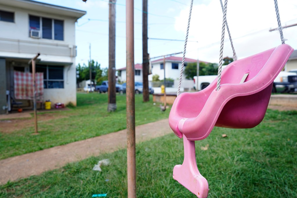 The child who plays in this swing soon will be forced to find a new home photographed Monday, Feb. 24, 2025, in Honolulu. These Kūhiō Park Terrace buildings are slated for demolition to clear land for a larger state housing authority apartment tower. (Kevin Fujii/Civil Beat/2025)