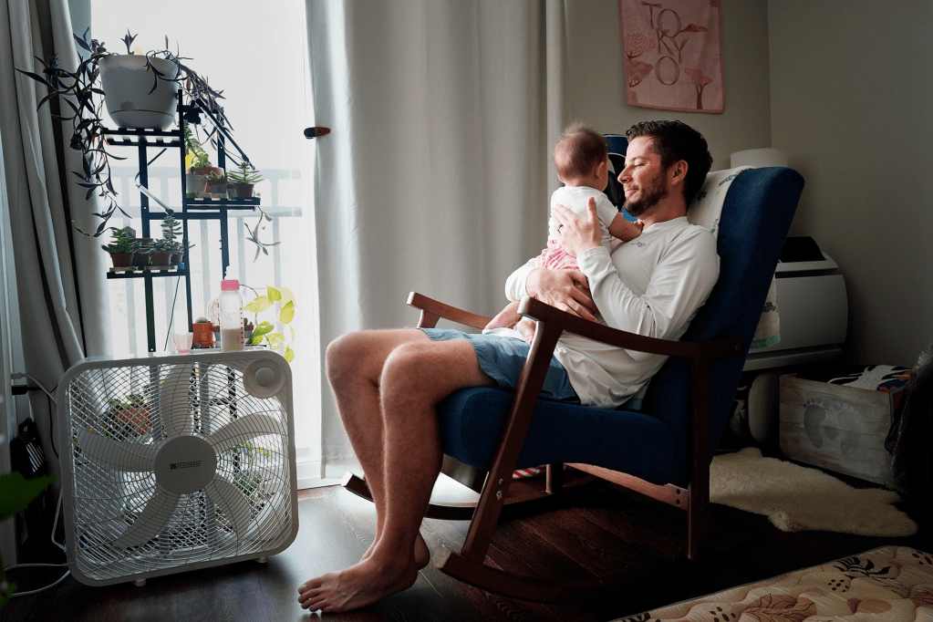 Nick Severson takes care of his daughter Thursday, Feb. 27, 2025, in Honolulu. Severson was let go as a probationary attorney with the Department of Housing and Urban Development. A silver lining Severson says is spending time with his seven-month-old daughter. (Kevin Fujii/Civil Beat/2025)
