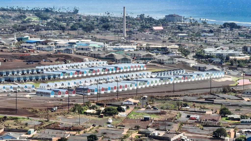 Temporary housing for fire survivors in Lahaina with Pioneer Mill in the background. (Nathan Eagle/Civil Beat/2025)