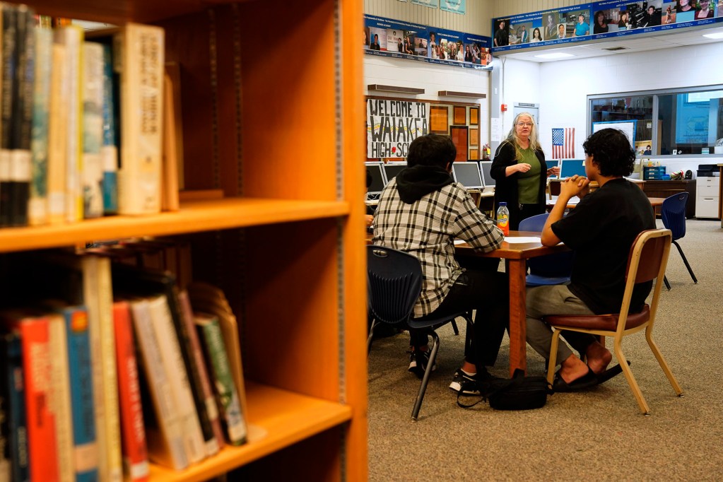 Waiākae High School librarian Leslie Fukushima leads a visiting class Monday, March 10, 2025, in Hilo. The topic for this class was banned books. (Kevin Fujii/Civil Beat/2025)