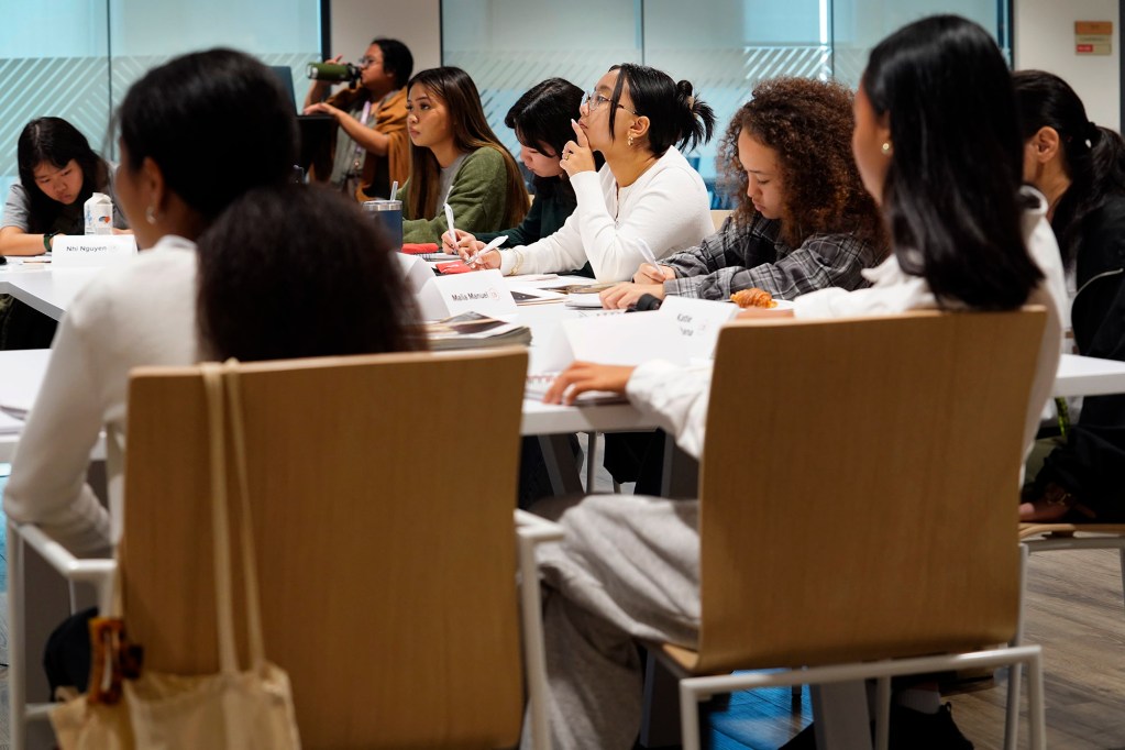 Youth journalism bootcamp participant Camille Irurita-Corpuz, center, listens intently Monday, March 17, 2025, in Honolulu. (Kevin Fujii/Civil Beat/2025)