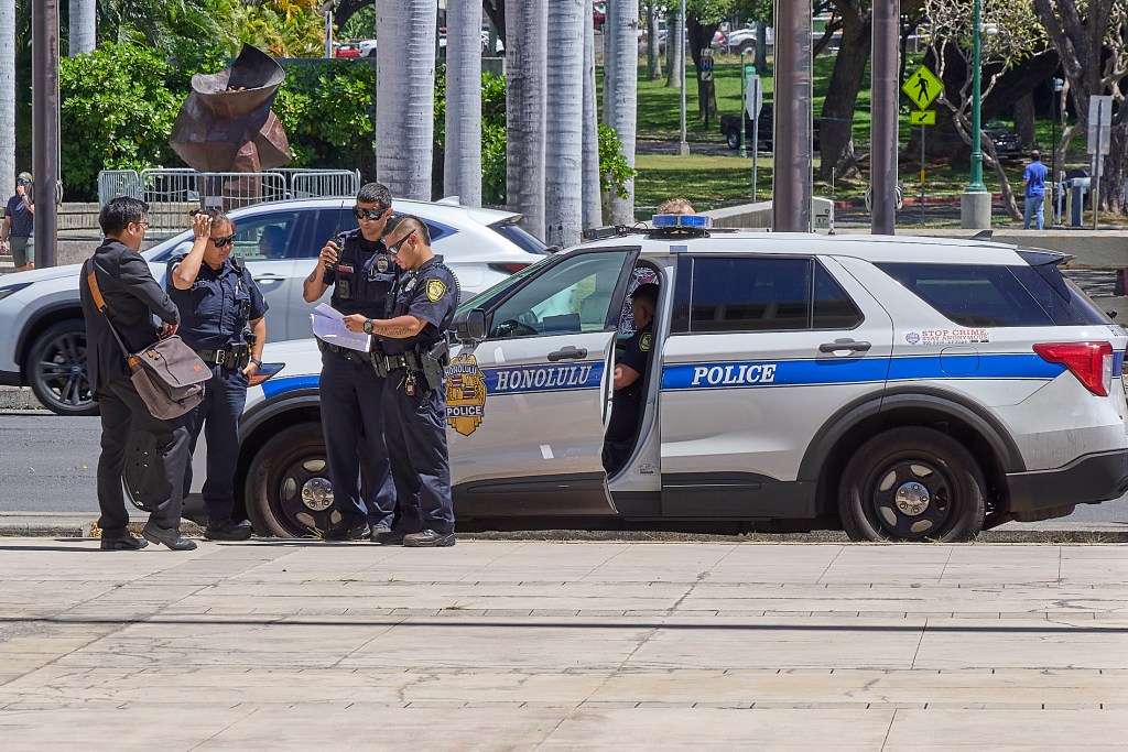Honolulu Police Officers meet outside the Hawaii Capital Building March 25th, 2025 (David Croxford/Civil Beat/2025)