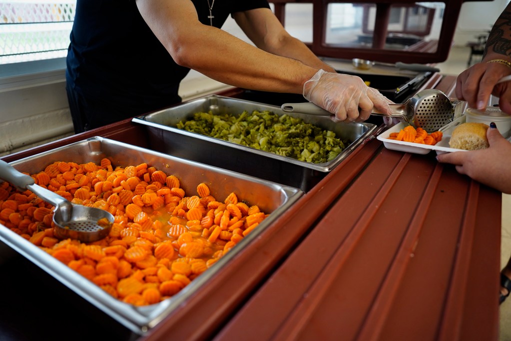 Vegetables and fruit are served to a Castle High School student’s lunch Monday, May 5, 2025, in Kāneʻohe. (Kevin Fujii/Civil Beat/2025)