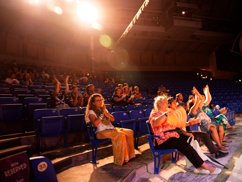 The World Fireknife Championships crowd applauds at the conclusion of the night’s competition at the Polynesian Culture Center Wednesday, May 14, 2025, in Lā’ie. The evening crowned a new senior women’s champion and finalists for the senior men. (Kevin Fujii/Civil Beat/2025)