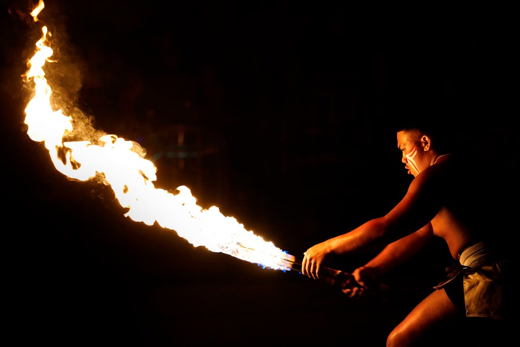 Matagi Lilo of ʻEwa Beach prepares to make a move that would light the the other ends of his double knives during the 2025 World Fireknife Championships take place at the Polynesian Culture Center Wednesday, May 14, 2025, in Lā‘ie. (Kevin Fujii/Civil Beat/2025)
