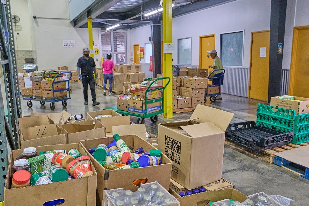 Views of the Hawaii Food Bank which delivers all manner of foods to many individuals and families from their warehouse on Kilihau Street. (David Croxford/Civil Beat/2025)