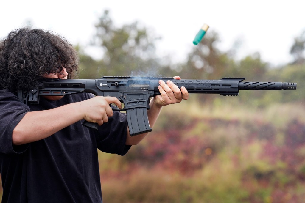 Paikea Hoomanawa Nui-Fierro, 14, of Puna, fires a Citadel Boss25 AR style semi-auto 12-guage shotgun Sunday, May 18, 2025, at Morita Camp Shooting Range 16 Mile Marker in Hilo. (Kevin Fujii/Civil Beat/2025)