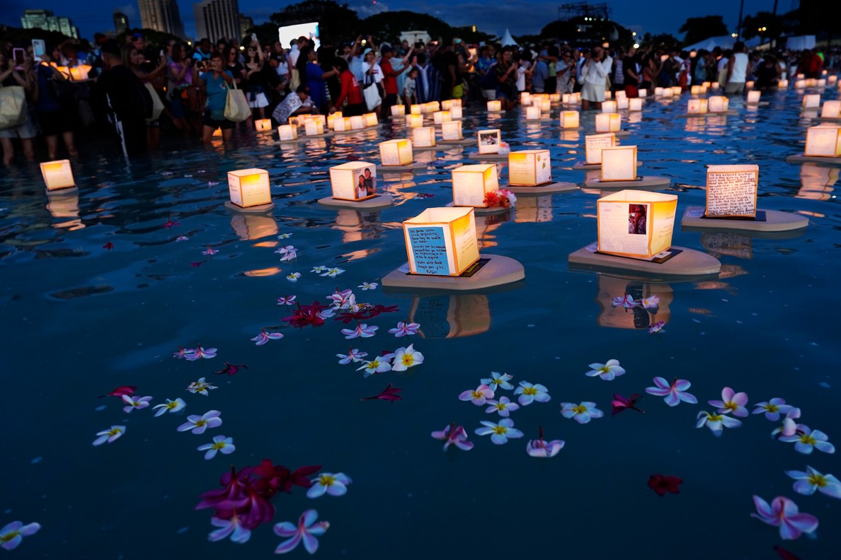 Plumeria flowers float along with individual lanterns during the 27th Annual Shinnyo Lantern Floating Hawaiʻi Monday, May 26, 2025, at Ala Moana Regional Park in Honolulu. 6,000 lanterns with messages to lost loved ones are launched by family members. (Kevin Fujii/Civil Beat/2025)