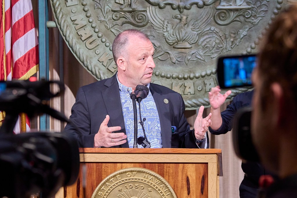 Hawaii Governor Josh Green signed a first in the Nation climate bill that initiates a 0.75% fee upon tourist spending in Hawaii(David Croxford/Civil Beat/2025)