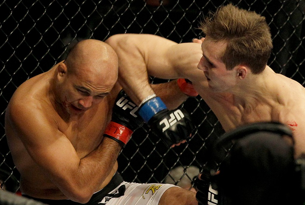Rory MacDonald, right, elbows BJ Penn in the first round of a welterweight mixed martial arts bout at a UFC on Fox event in Seattle, Saturday, Dec. 8, 2012. MacDonald won by unanimous decision. (AP Photo/Jeff Chiu)