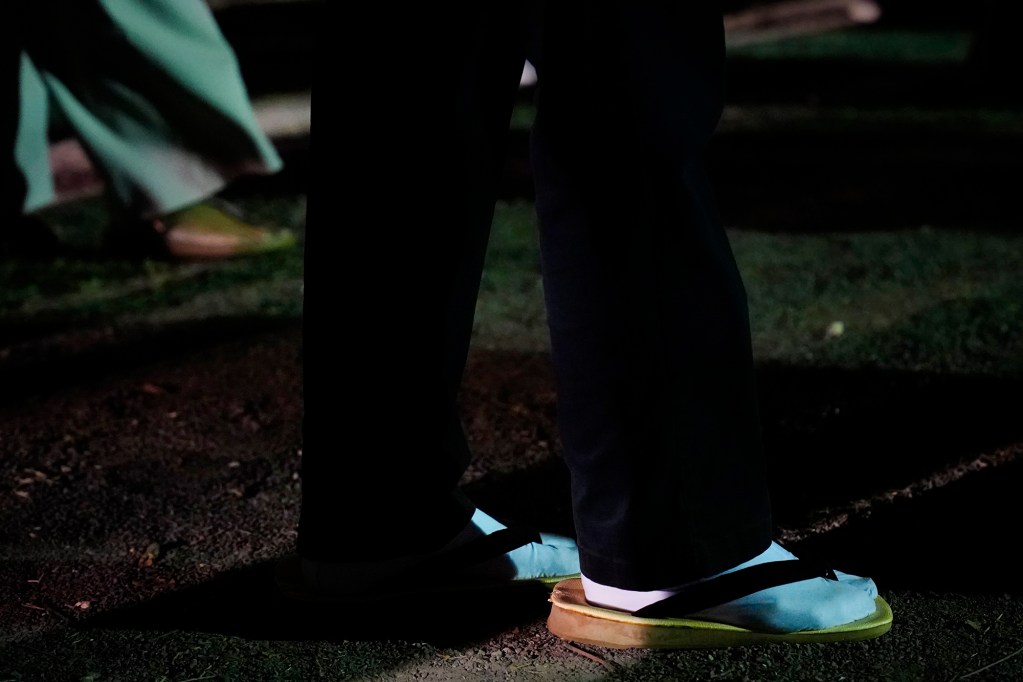 A dancer breaks out zori, traditional Japanese sandals, and tabi socks for the first Bon Dance of the season Saturday, June 7, 2025, at Hawaii’s Plantation Village in Waipahu. The summer Obon season is a Japanese Buddhist tradition to celebrate life and honor ancestors. (Kevin Fujii/Civil Beat/2025)