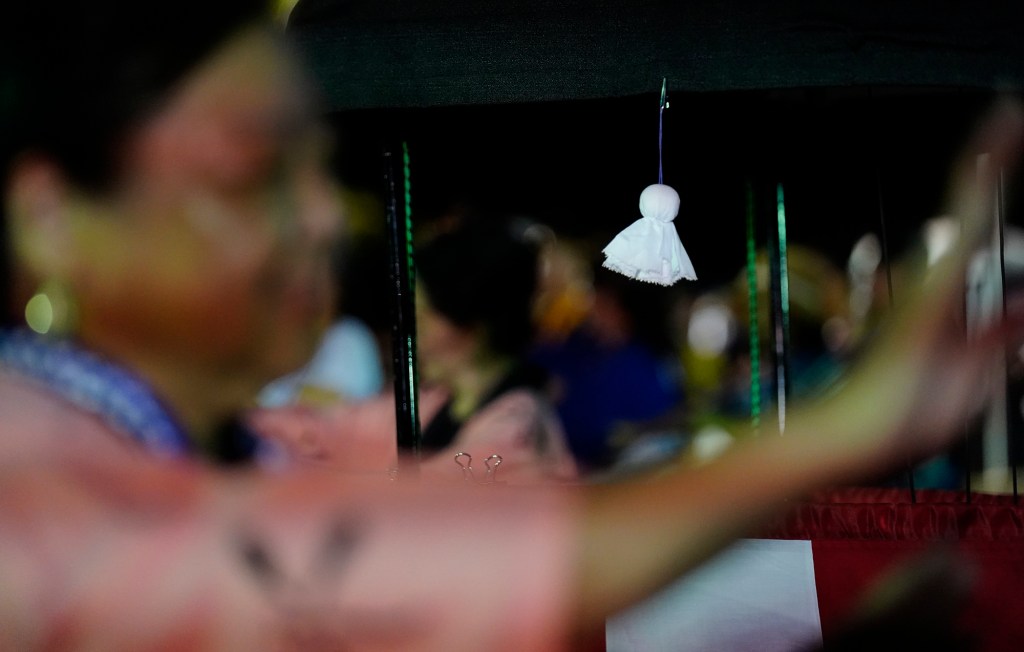 A Teru Teru Bozu hangs in the yagura during the first Bon Dance of the season Saturday, June 7, 2025, at Hawaii’s Plantation Village in Waipahu. Teru Teru Bozu wards off bad weather, especially rain. (Kevin Fujii/Civil Beat/2025)