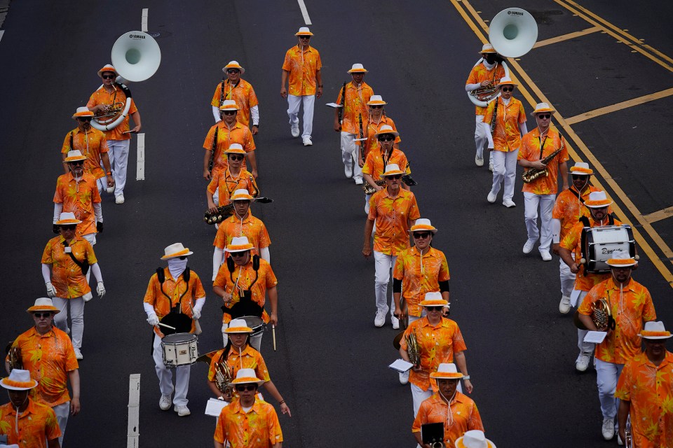 The Royal Hawaiʻian Band marches in the 108th King Kamehameha Celebration Floral Parade Saturday, June 14, 2025, in Honolulu. The band was established by King Kamehameha III in 1836. In its 153 year, the King Kamehameha Day Celebrations honor Kamehameha I, the “Father of the Hawaiian Kingdom,” who united the Hawaiian Islands under one rule. His great-grandson King Kamehameha V established King Kamehameha Day in 1971. It was first observed on June 11, 1872. (Kevin Fujii/Civil Beat/2025)
