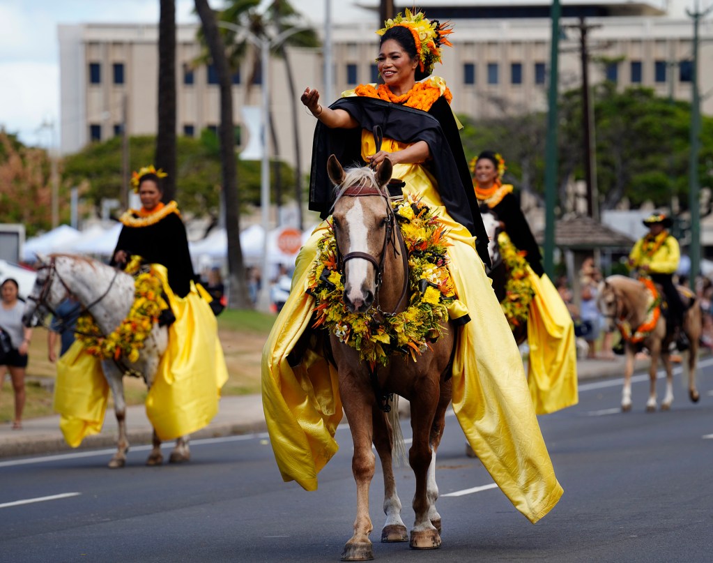 108th King Kamehameha Celebration Floral Parade Island of O'ahu Pā‘ū Princess Theresa Ramento Tehiva greets the crowd Saturday, June 14, 2025, in Honolulu. In its 153 year, the King Kamehameha Day Celebrations honor Kamehameha I, the “Father of the Hawaiian Kingdom,” who united the Hawaiian Islands under one rule. His great-grandson King Kamehameha V established King Kamehameha Day in 1971. It was first observed on June 11, 1872. (Kevin Fujii/Civil Beat/2025)