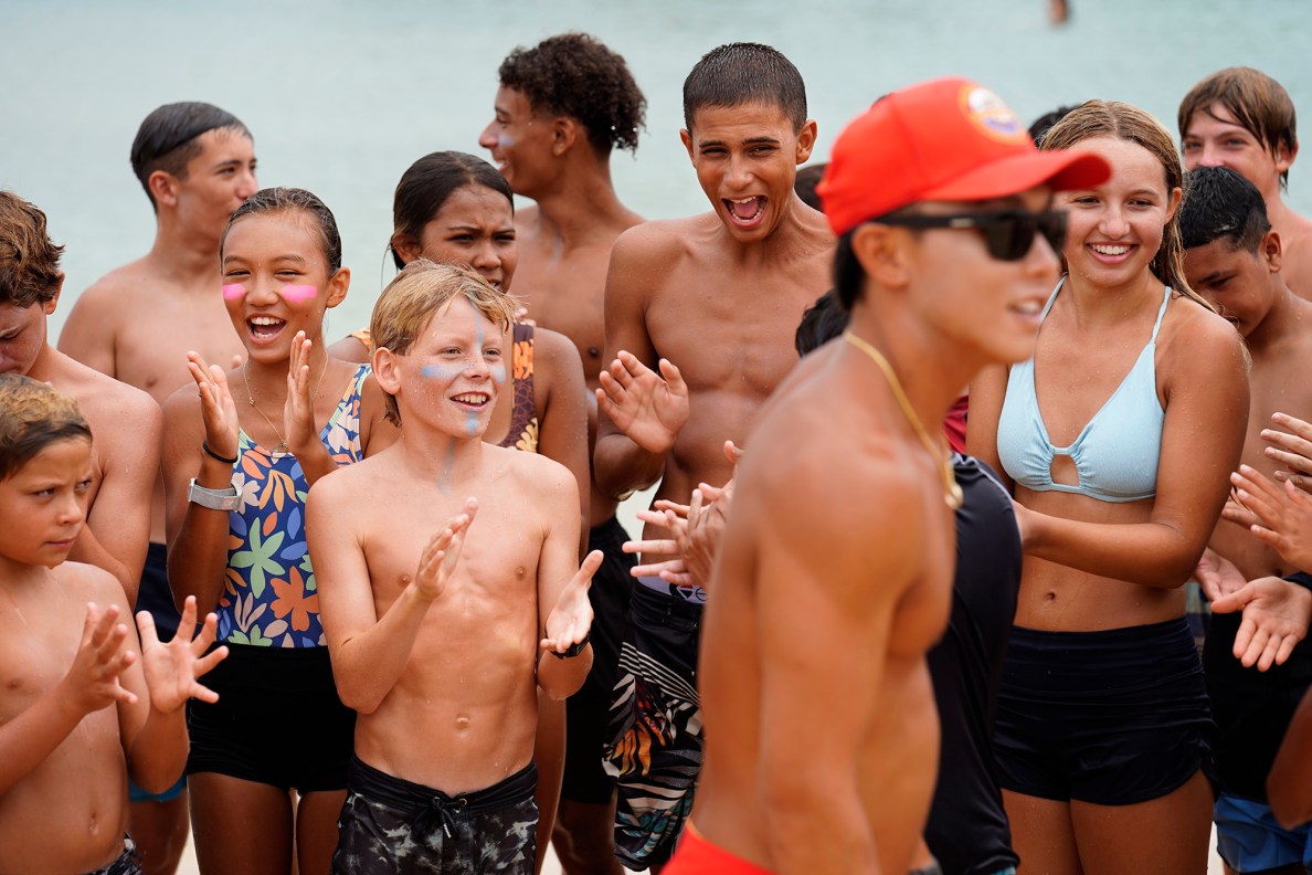 Honolulu Ocean Safety Department’s Junior Lifeguard Program participants cheer for the program’s leader Kainoa McGee at Ko’olina Wednesday, June 25, 2025, in Kapolei. (Kevin Fujii/Civil Beat/2025)