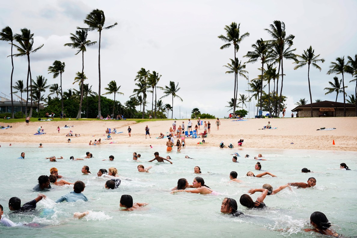 Honolulu Ocean Safety Department’s Junior Lifeguard Program participants swim out and back during a beach-fitness exercise Kainoa McGee calls, “The Burn,” during its weeklong program at Ko’olina Wednesday, June 25, 2025, in Kapolei. (Kevin Fujii/Civil Beat/2025)