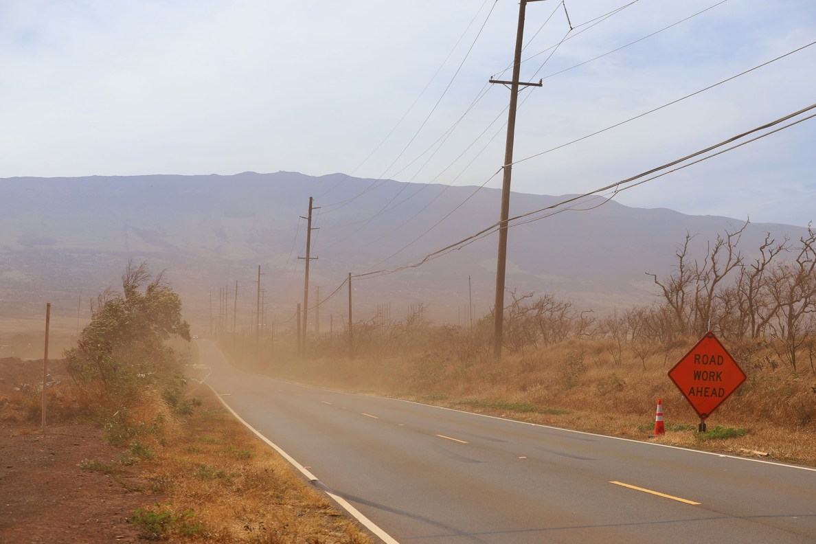 Wind kicks up dust on the road near the Maui landfill site