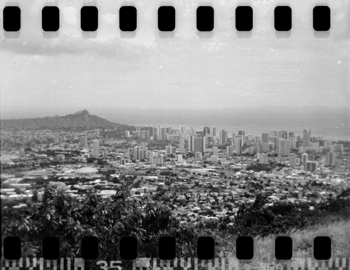 The scene from the Puʻu ʻUalakaʻa State Wayside viewpoint is photographed with 35mm film in a Holga for a test shoot Friday, June 27, 2025, around Honolulu. (Kevin Fujii/Civil Beat/2025)