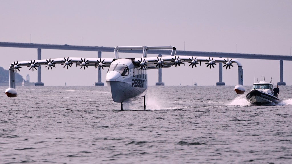 The REGENT Viceroy Seaglider, a winged passenger ferry, glides over the surface of Narragansett Bay on a test run, Wednesday, Aug. 6, 2025, off the coast of North Kingstown, R.I. (AP Photo/Charles Krupa)