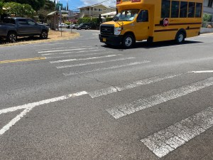 A school bus passes through an intersection on Mahoe Street in Waipahu. The crosswalk, sidewalks and signage around August Ahrens Elementary School will be upgraded using funds from the Safe Routes to Schools program.