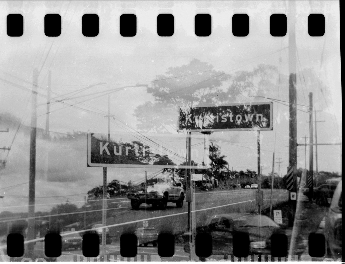 An accidentally double-exposed photo from Kurtistown shows the town where alleged child abuse took place is photographed on film Tuesday, Sept. 2, 2025, in Kurtistown. This is part of John Hill’s project on an accused child abuser and molester moved around Oʻahu and Hawaiʻi islands. (Kevin Fujii/Civil Beat/2025)