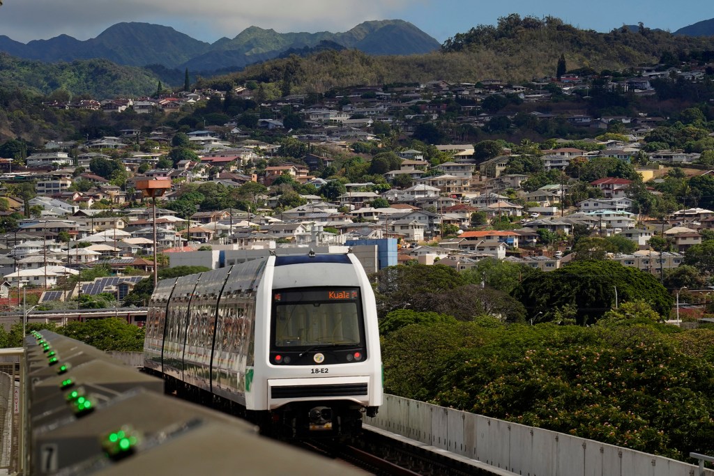 A Skyline commuter enters the Hālawa Aloha Stadium station Thursday, Oct. 9, 2025, in Honolulu. (Kevin Fujii/Civil Beat/2025)