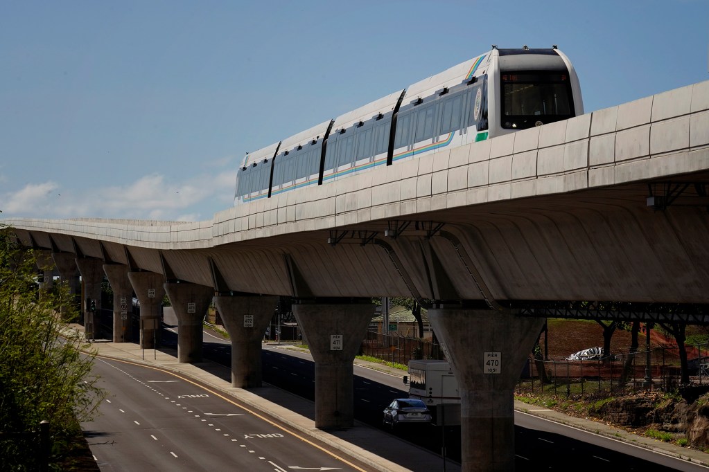 A Honolulu Authority for Rapid Transportation’s Skyline train on the Section 2 route as seen from the Makalapa Pearl Harbor Naval Base station Thursday, Oct. 9, 2025, in Honolulu. (Kevin Fujii/Civil Beat/2025)