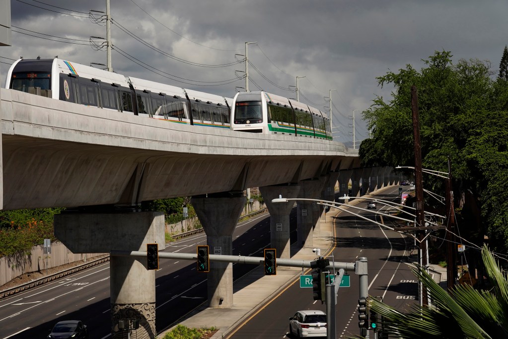 Two Honolulu Authority for Rapid Transportation’s Skyline trains on the Section 2 route as seen from the Makalapa Pearl Harbor Naval Base station Thursday, Oct. 9, 2025, in Honolulu. (Kevin Fujii/Civil Beat/2025)