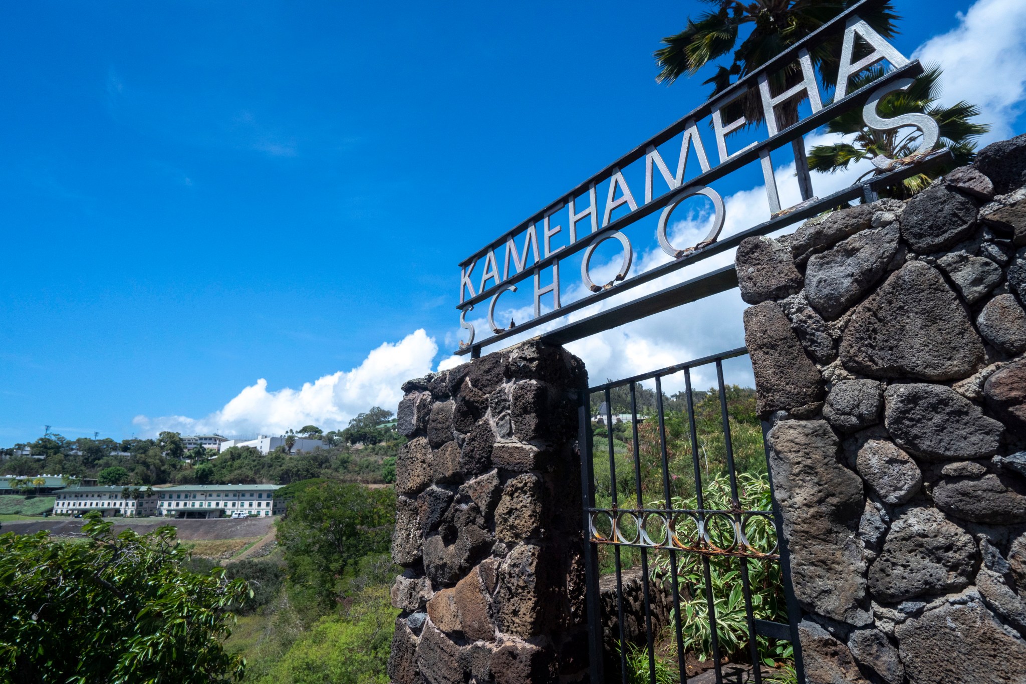 The entrance sign of Kamehameha Schools stands in front of the campus in Honolulu, on Thursday, Sept. 11, 2025. (AP Photo/Mengshin Lin)