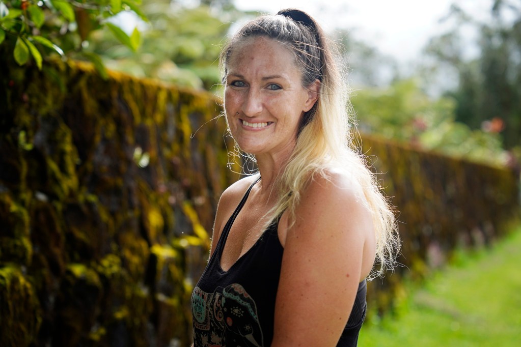 Heather Hofferbert and her dog Trippy are photographed Friday, Oct. 31, 2025, in Hilo. The two were staying in a domestic-abuse shelter and were forced to move to Hilo after funding was cut. (Kevin Fujii/Civil Beat/2025)