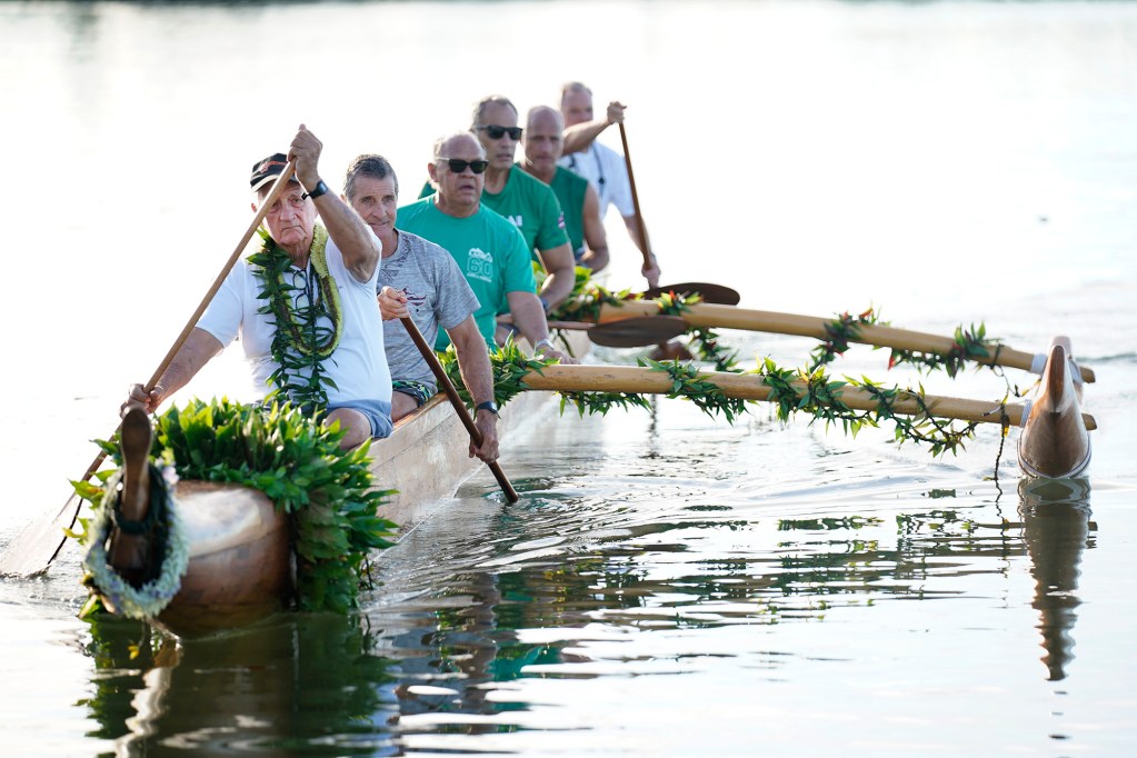 Tay Perry strokes the A‘a back to shore after the ceremonial blessing and paddle at Ke‘ehi Lagoon returns Prince Jonah Kūhiō Kalanianaʻole’s famous koa racing canoe back to the ocean Saturday, Nov. 8, 2025, in Honolulu. (Kevin Fujii/Civil Beat/2025)