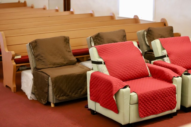 Rev. Dr. Kimberly Fong said she and other church leaders spent more than a year preparing Po'okela Church to house up to 22 volunteers at a time. So volunteers would have a place to sleep, the church purchased several reclining chairs and set them up wherever there was space — pastoral offices, storage rooms and even the church's main worship area. (Erin Nolan/Civil Beat/2025)