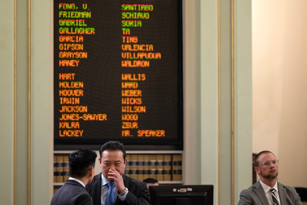 Assemblymember Evan Low speaks with a fellow lawmaker Phillip Chen at the Capitol on March 27, 2023. Photo by Miguel Gutierrez Jr., CalMatters