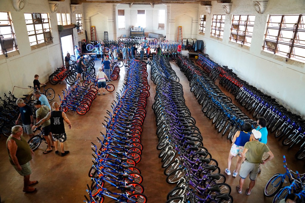 One of four Jim Falk’s annual Christmas Kids Bike Build days takes place Saturday, Dec. 6, 2025, in Puʻunēnē. Approximately 450 new bicycles are built and will distributed to keiki in Maui County. (Kevin Fujii/Civil Beat/2025)