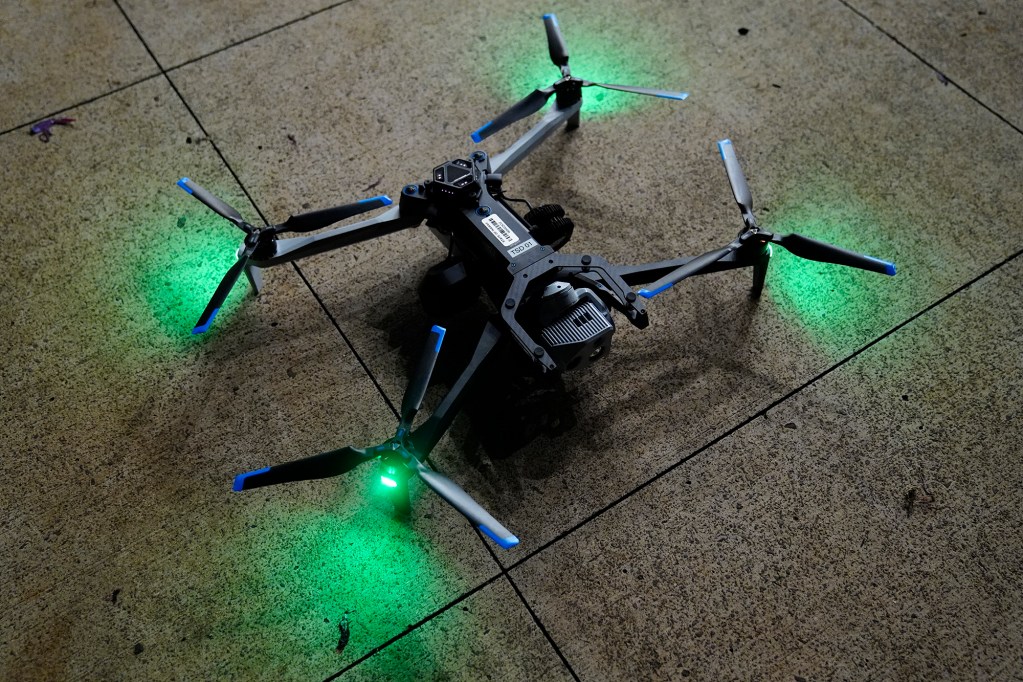 A drone lands before Department of Law Enforcement Director Mike Lambert takes journalists on a ride along Wednesday, Dec. 31, 2025, in Waipahu. New laws, the use of aerial drones and citizens heeding the dangers of fireworks noticeably  curbed the annual personal pyrotechnics. (Kevin Fujii/Civil Beat/2025)
